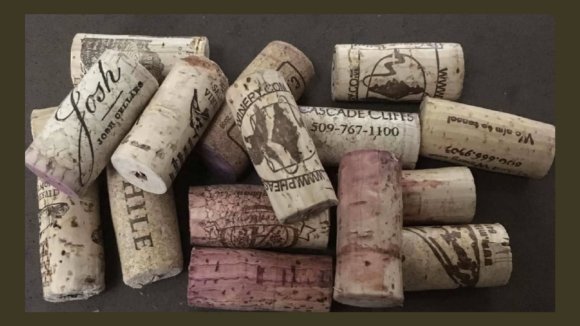 Many wine bottle corks on a brown background