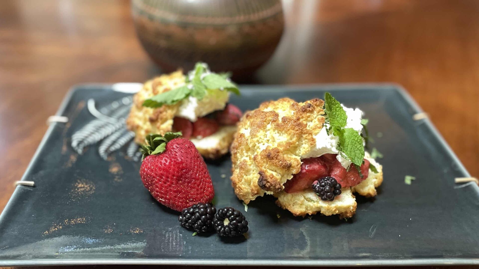 Strawberry Shortcakes on a dark green platter