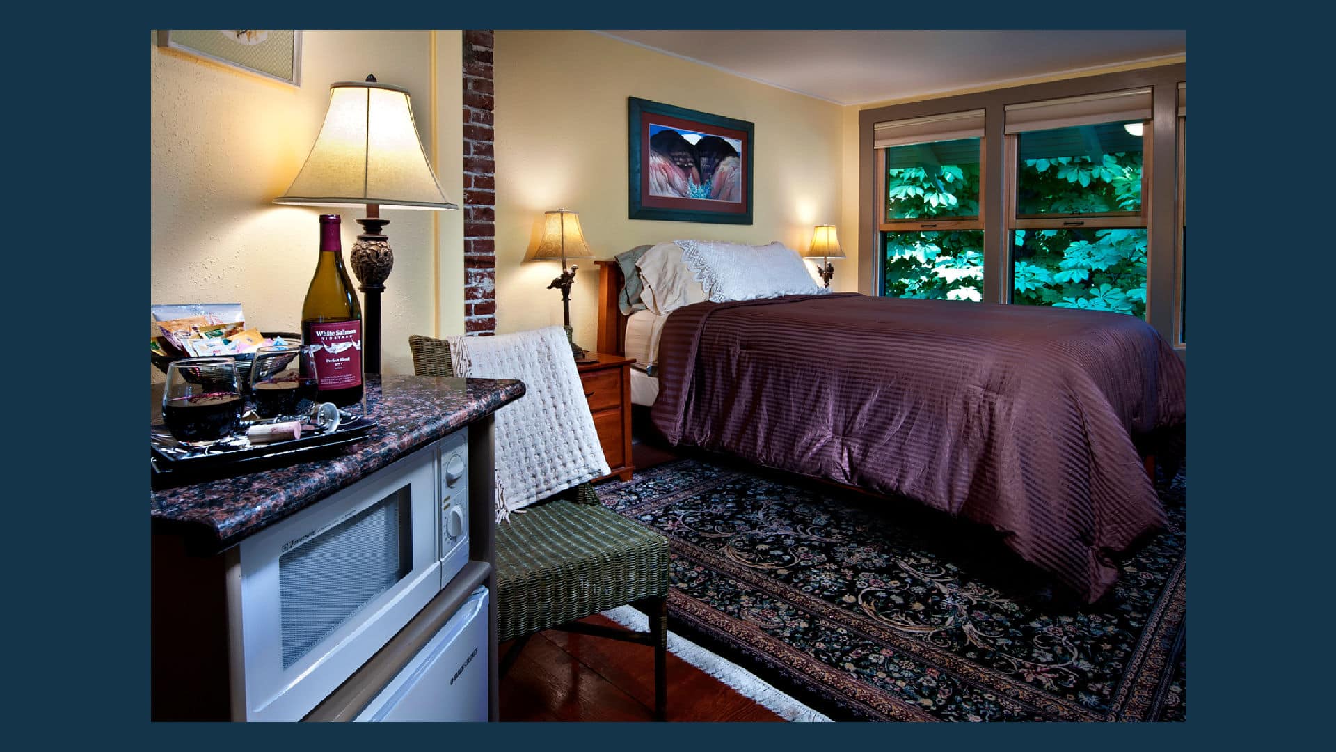 Made up bed covered with a brown bedspread, in light yellow room