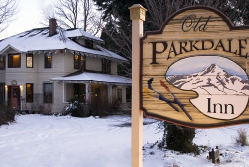 Street Sign for the Old Parkdale Inn with the inn in the background